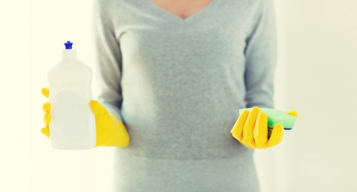 Carpet cleaning technician treating a high-traffic area in a Canary Wharf property